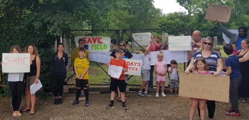 Parents and children protest at the sale of their playing field